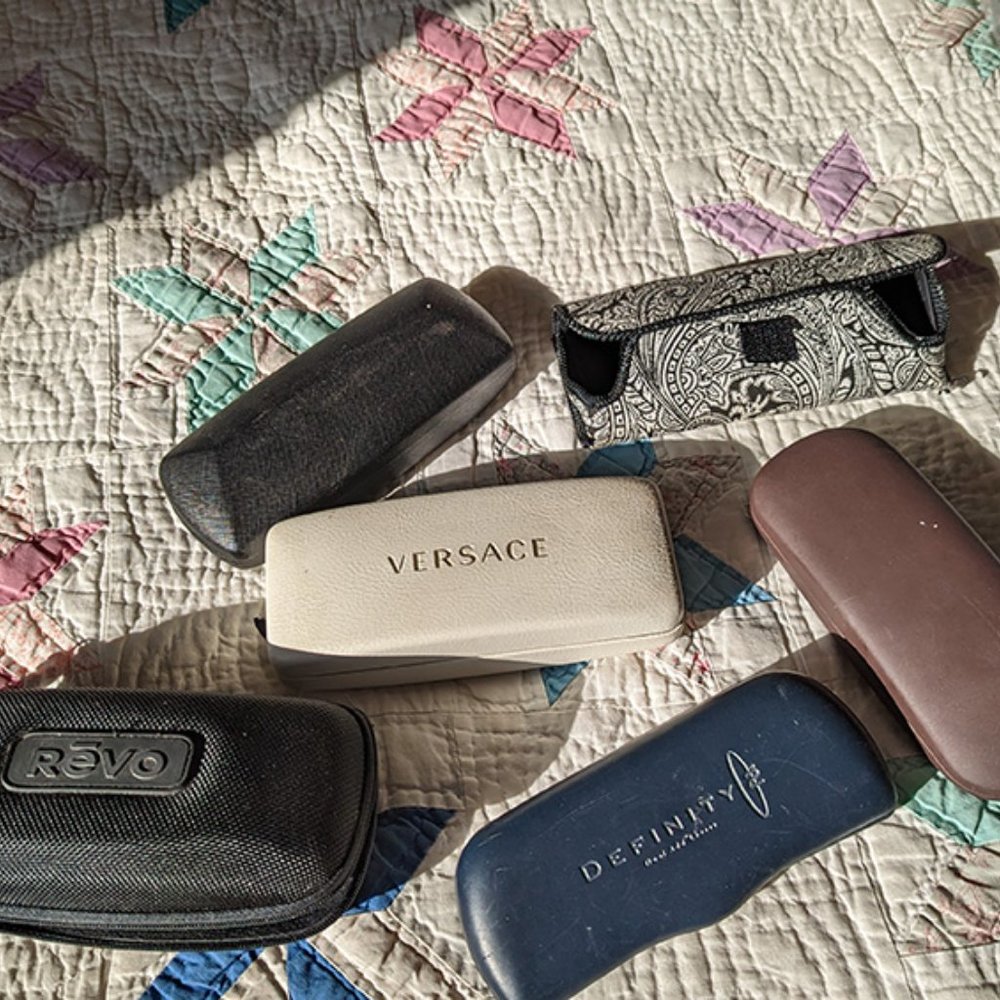 A variety of 6 hard and soft shell eyeglass caases.